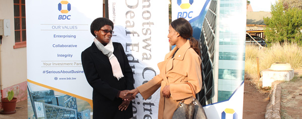 All smiles celebrating a golden handshake moment BDC Head - Corporate Affairs and Strategy Ms Lebang with Ramotswa Centre for the Deaf School Head Teacher Ms Tlhalerwa